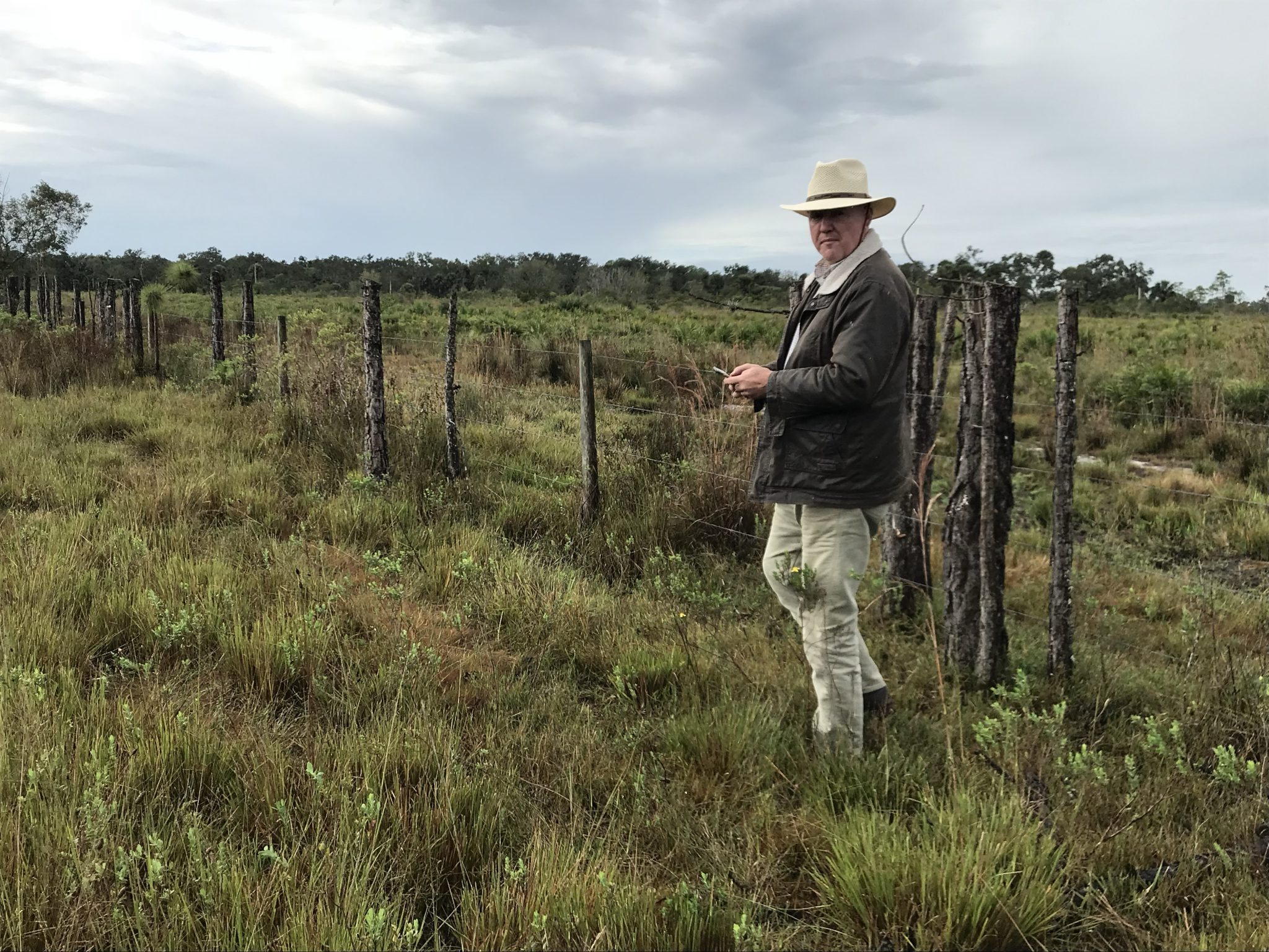 Tony Lovell standing next to a fence